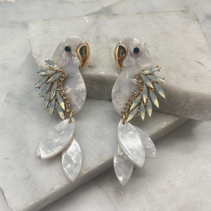A photo of the Parrot Earrings In White product