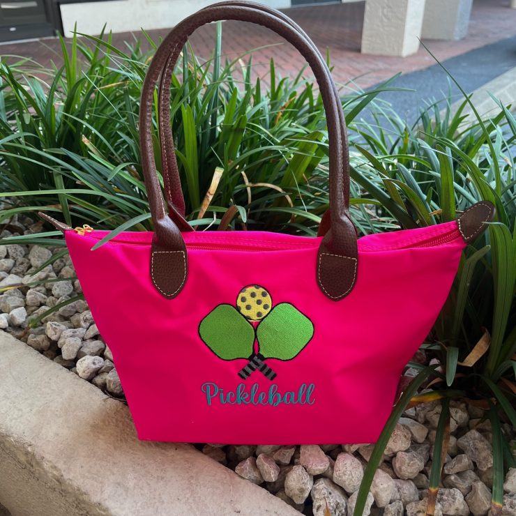 A photo of the Nylon Pickleball Tote In Neon Pink product