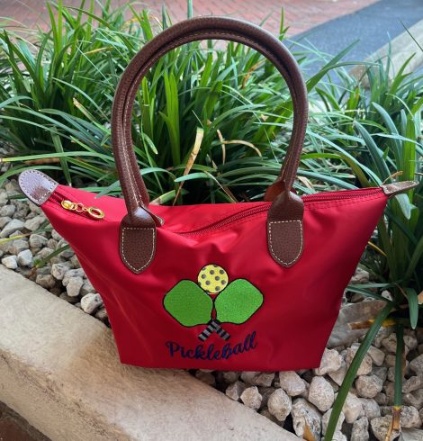 A photo of the Nylon Pickleball Tote In Red product