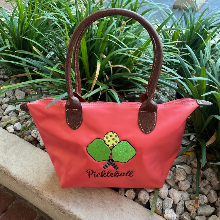 A photo of the Nylon Pickleball Tote In Coral product