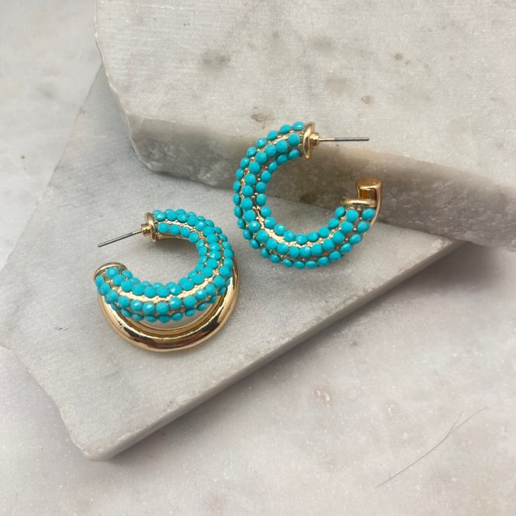 A photo of the Turquoise Double Hoops In Gold product