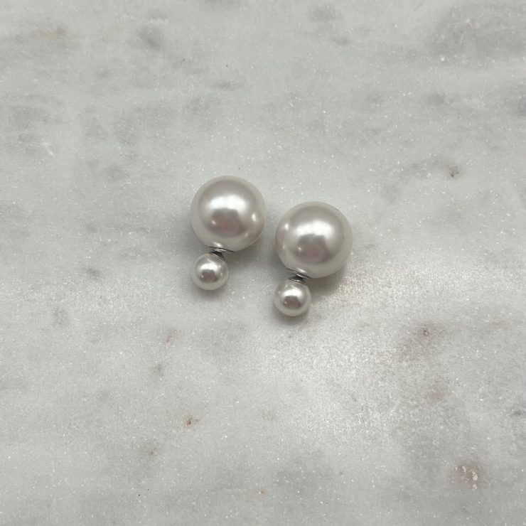 A photo of the Sterling Silver Pearl Peek-A-Boo Earrings product