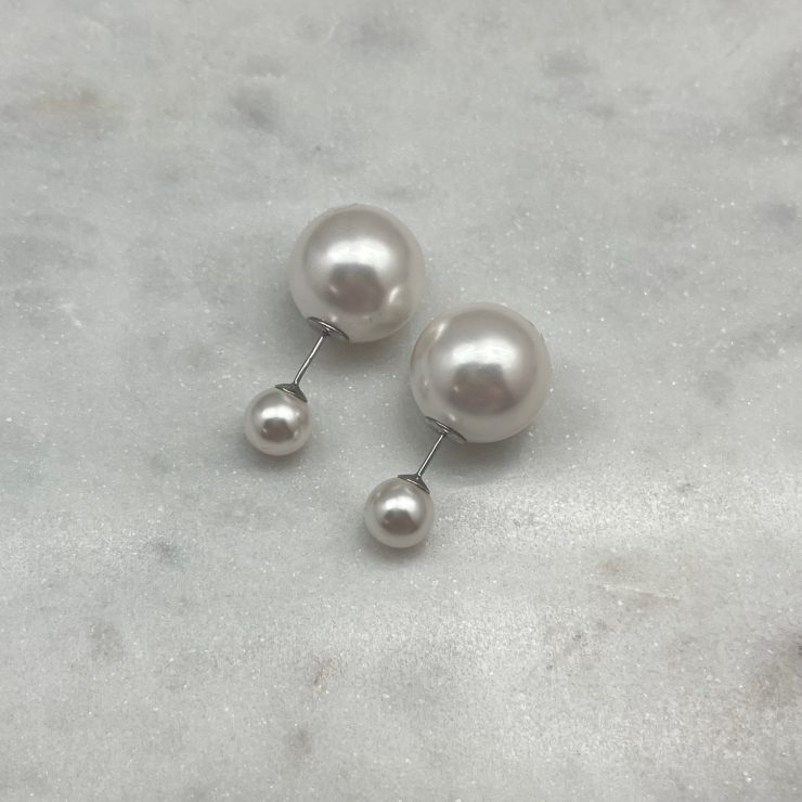 A photo of the Sterling Silver Pearl Peek-A-Boo Earrings product