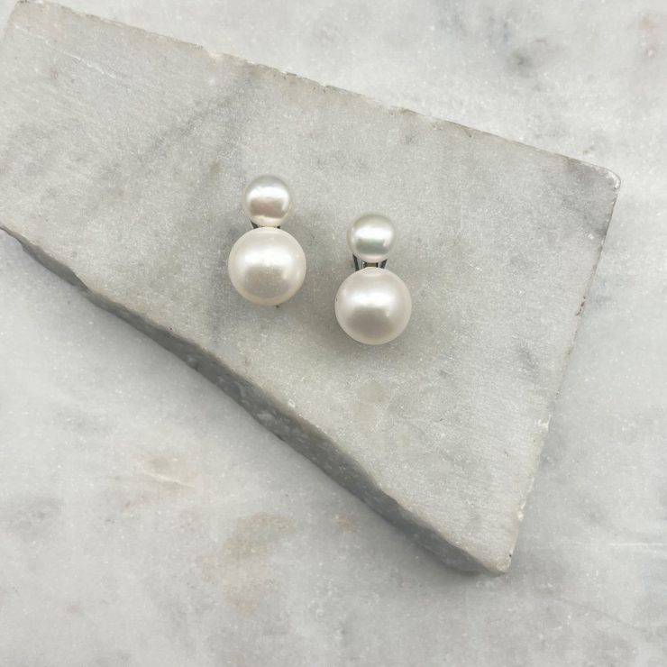 A photo of the Double Pearl Lever Back Earrings product