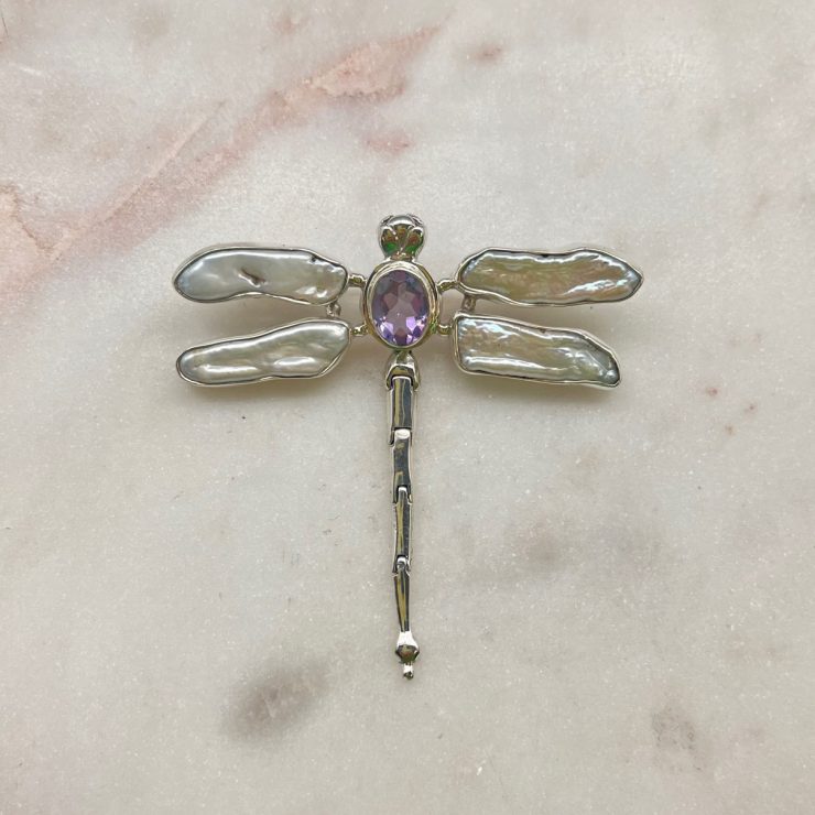 A photo of the Amethyst & Mother of Pearl Dragonfly Pendant product