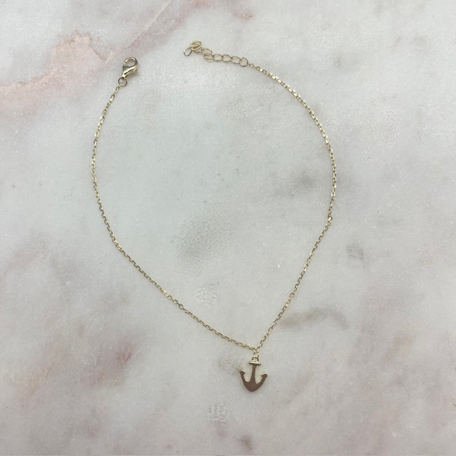 A photo of the Anchor Charm Anklet In Gold product