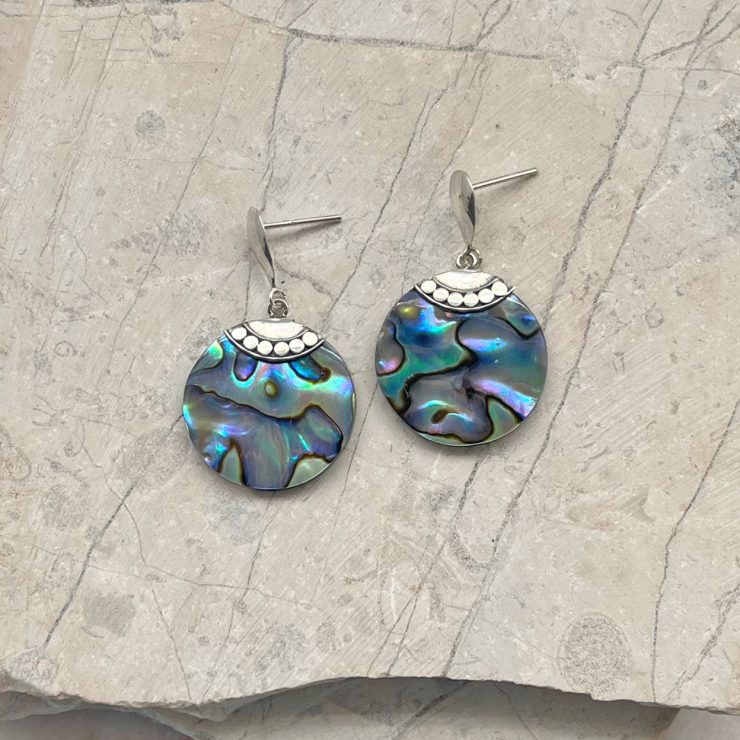 A photo of the Circle Abalone Earrings product