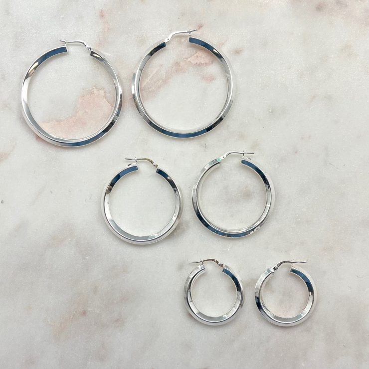A photo of the Sterling Silver Diamond Tube Hoops product