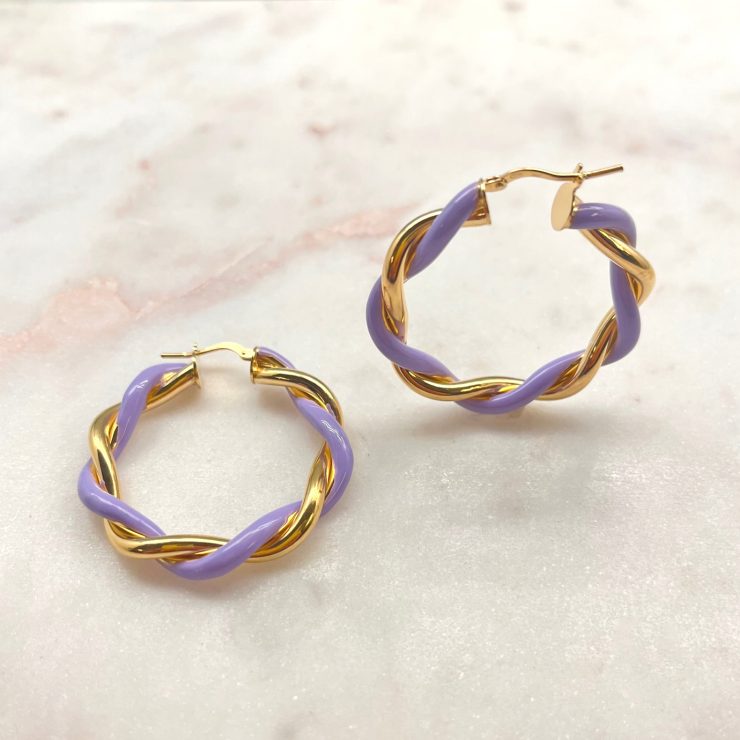 A photo of the Lilac & Gold Italian Twist Hoops product