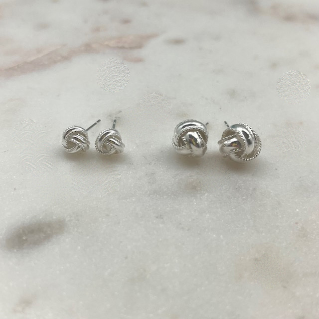 A photo of the Love Knot Stud Earrings product