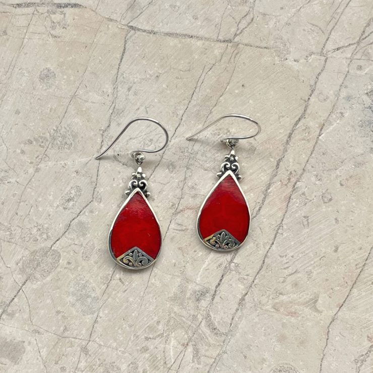 A photo of the Teardrop Red Shell Earrings product