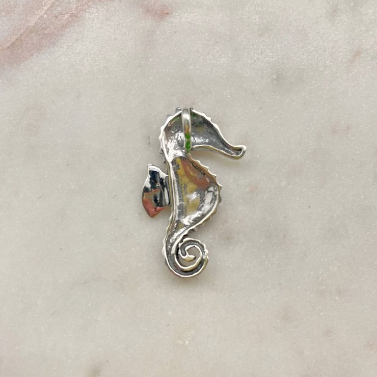 A photo of the Mother of Pearl Seahorse Pendant product