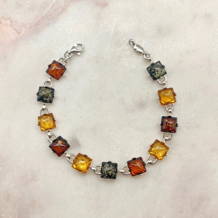 A photo of the Square Multicolored Amber Bracelet product