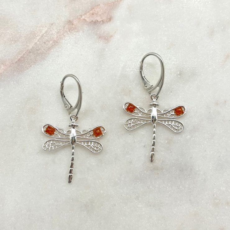 A photo of the Sterling Silver & Amber Dragonfly Earrings product