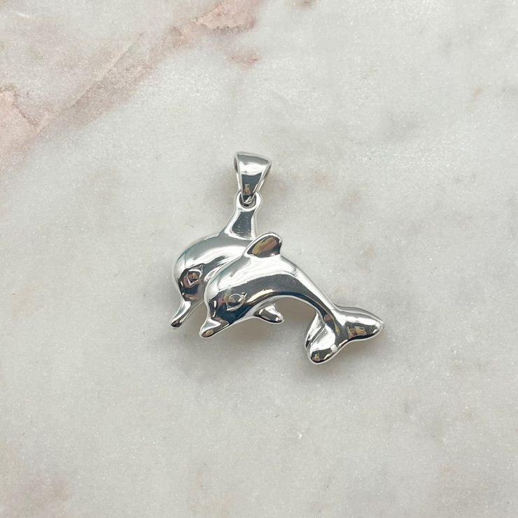 A photo of the Sterling Silver Double Dolphin Puffed Pendant product