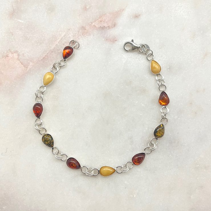 A photo of the Teardrop Multicolored Amber Sterling Bracelet product