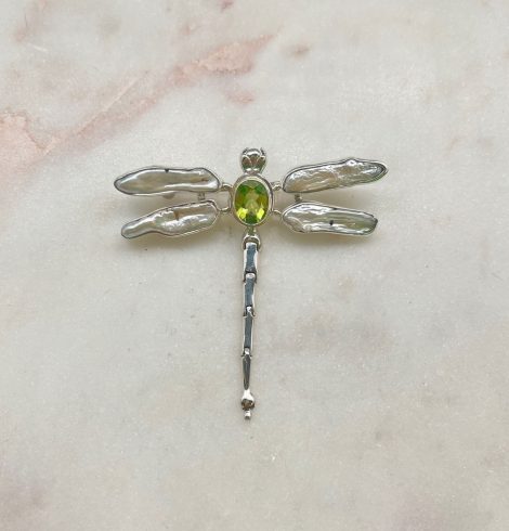 A photo of the Peridot & Mother of Pearl Dragonfly Pendant product