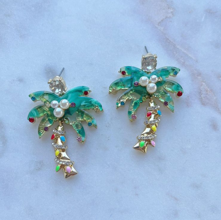 A photo of the Christmas Palm Earrings in Green product