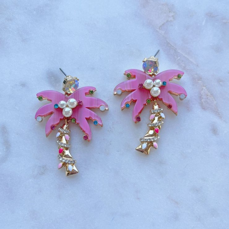 A photo of the Christmas Palm Earrings in Pink product