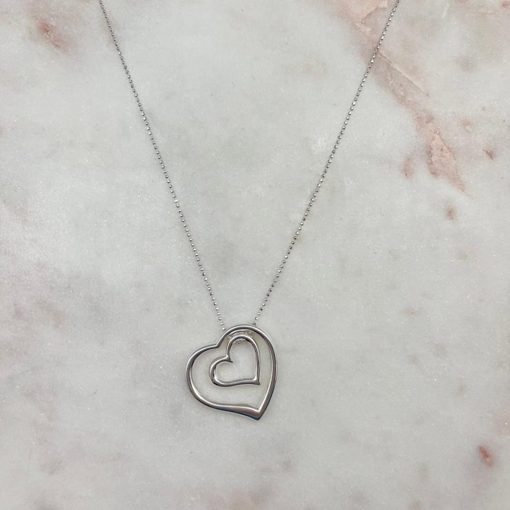 A photo of the Double Floating Heart Necklace product