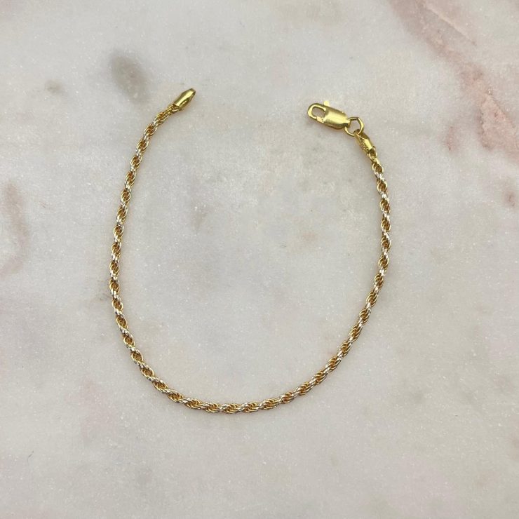 A photo of the Two Tone Rope Twist Bracelet product