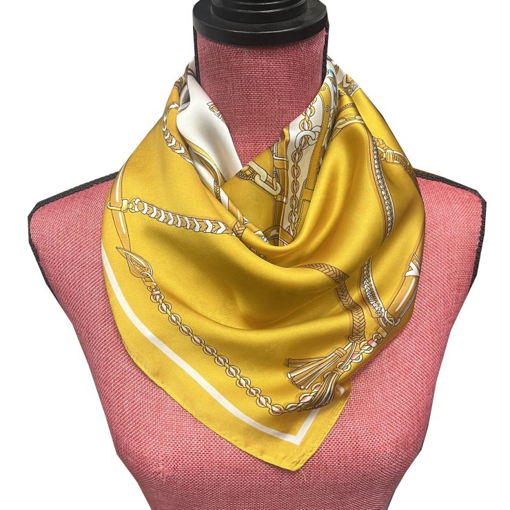 A photo of the Rope & Chain Scarf in Mustard product