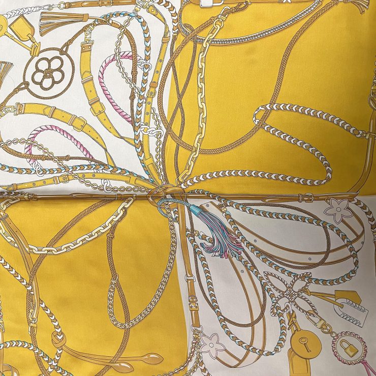 A photo of the Rope & Chain Scarf in Mustard product