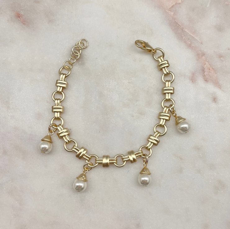 A photo of the Classy Pearl Toggle Bracelet product