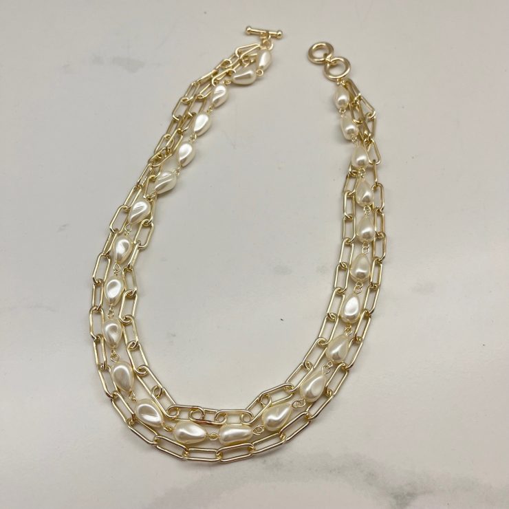 A photo of the Izzy Necklace in Gold product