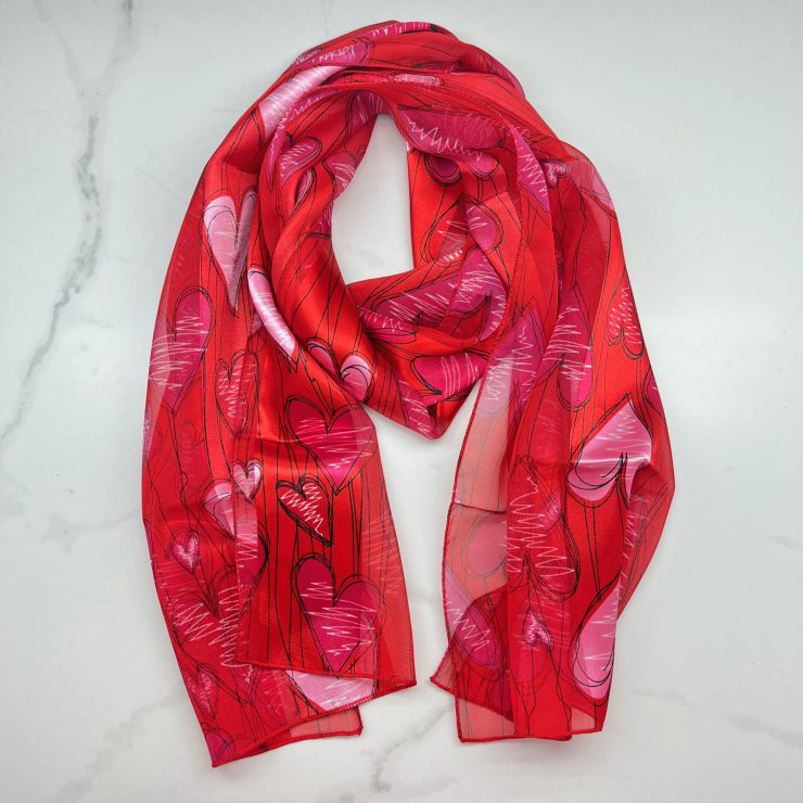 A photo of the Lucky Hearts Scarf in Red product