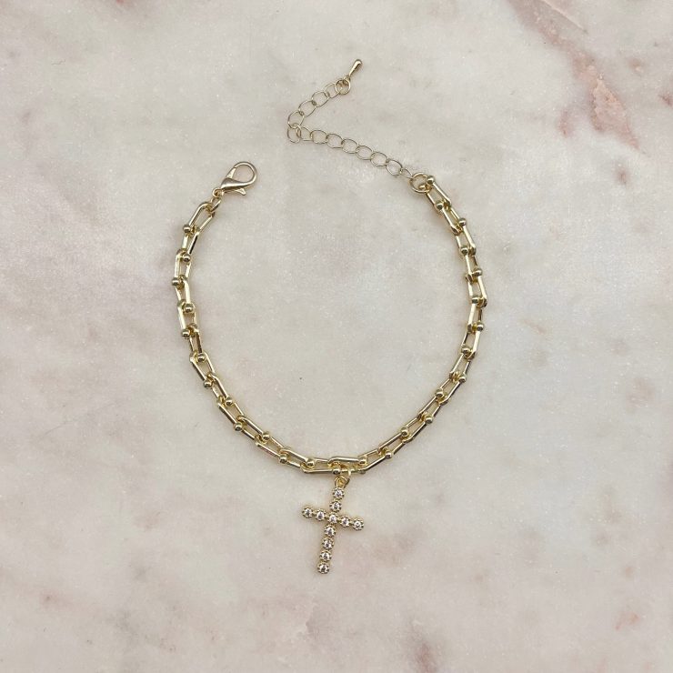 A photo of the Paperclip Cross Charm Bracelet product