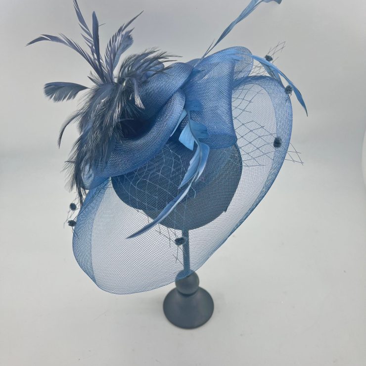 A photo of the Feather Fascinator in Navy product