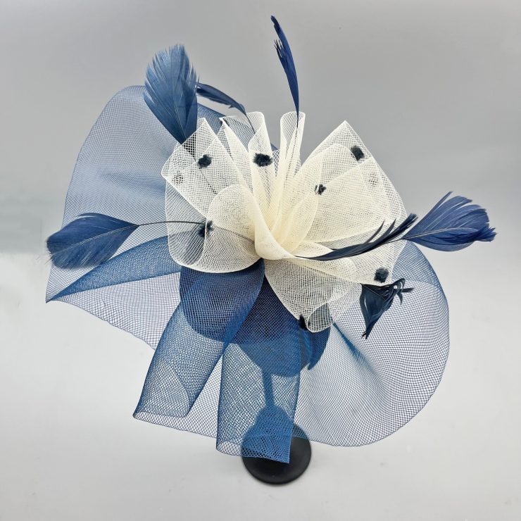 A photo of the Nita Fascinator in Navy & Cream product