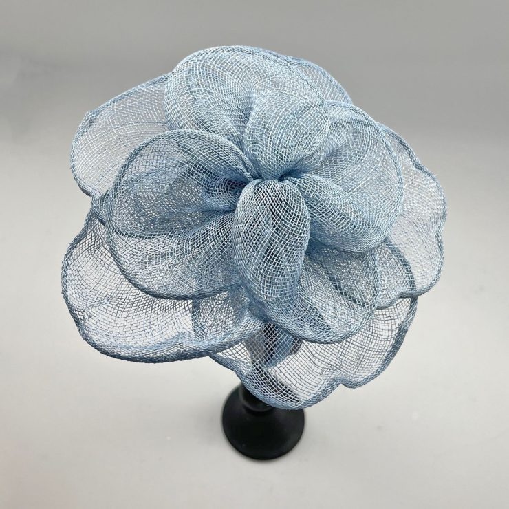 A photo of the Rosa Fascinator in Light Blue product