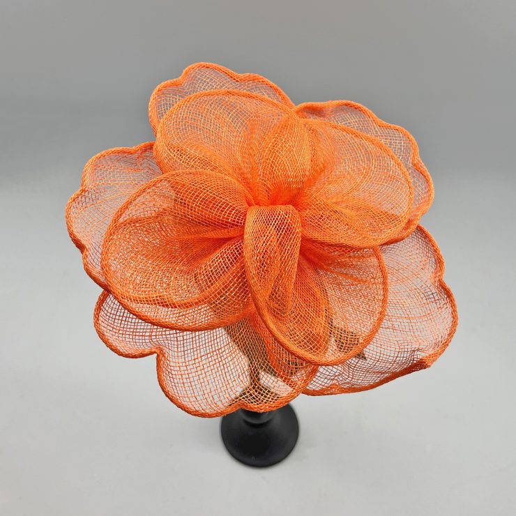 A photo of the Rosa Fascinator in Orange product