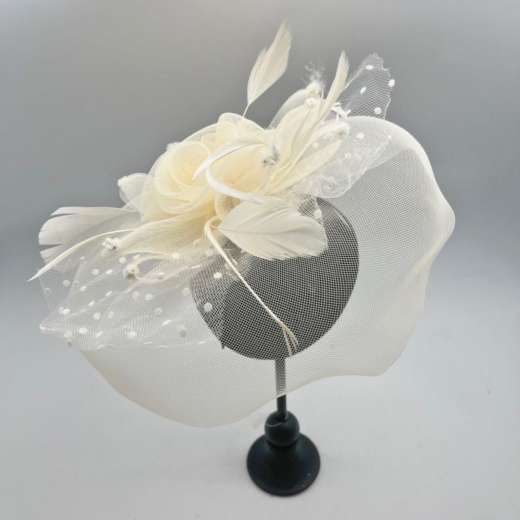 A photo of the Flora Fascinator in Cream product