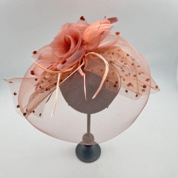 A photo of the Flora Fascinator in Light Brown product