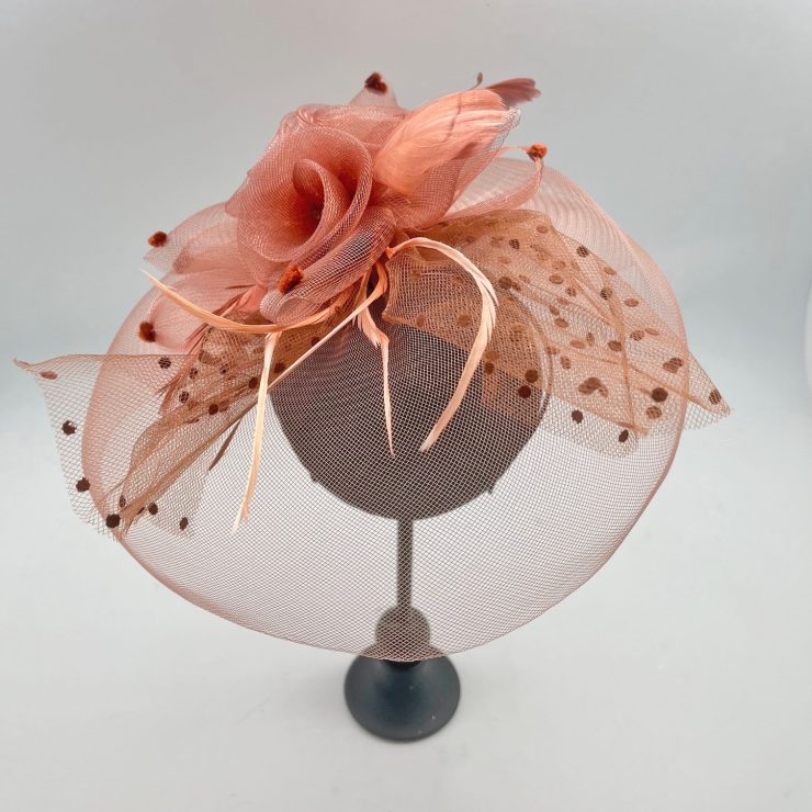 A photo of the Flora Fascinator in Light Brown product