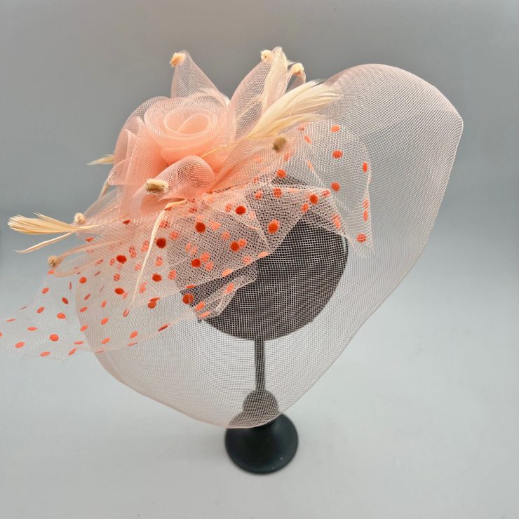 A photo of the Flora Fascinator in Peach product