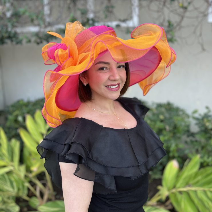 A photo of the Nora Fascinator Hat in Orange & Hot Pink product