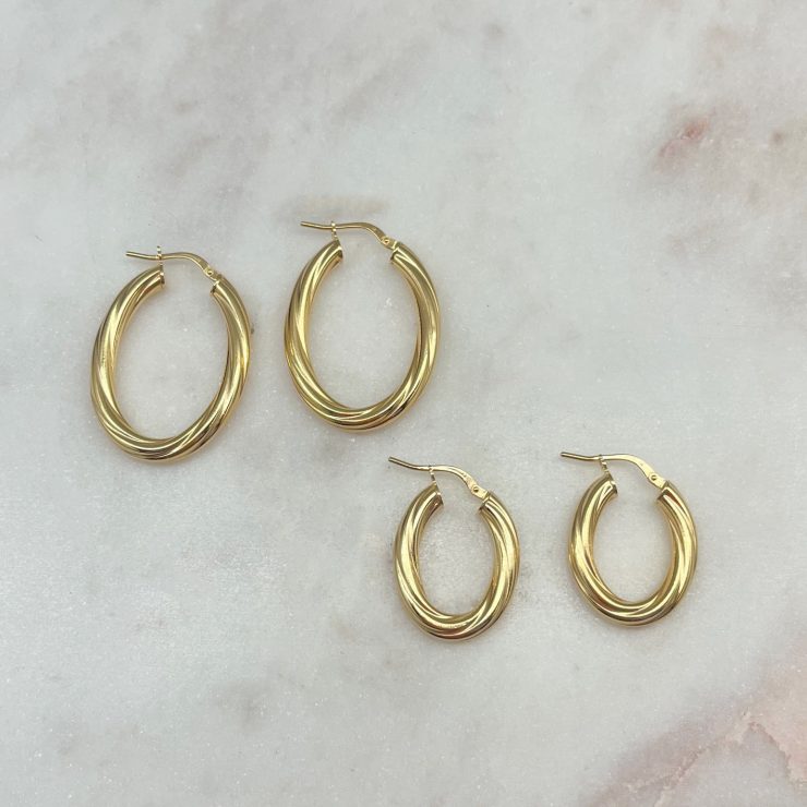 A photo of the Nora Twist Gold Plated Hoops product
