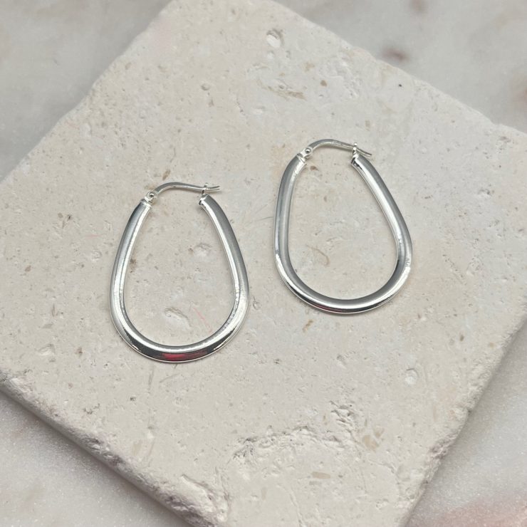 A photo of the Italian Sterling Silver Flat Oval Hoops product