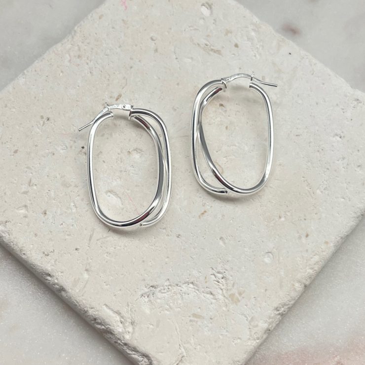 A photo of the Italian Sterling Silver Infinity Oval Hoops product