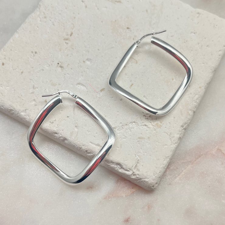 A photo of the Italian Sterling Silver Square Wavy Hoops product