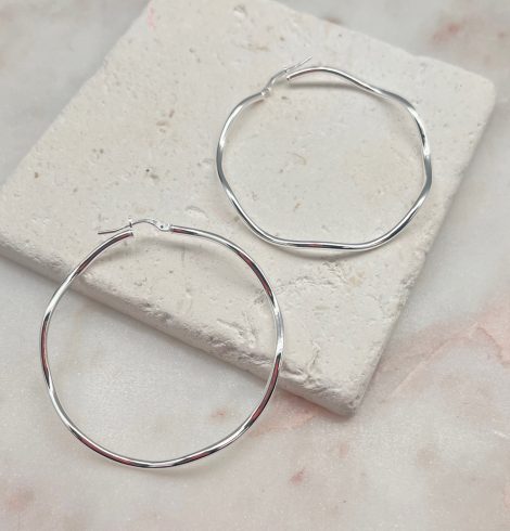 A photo of the Italian Sterling Silver Wide Wave Hoops product