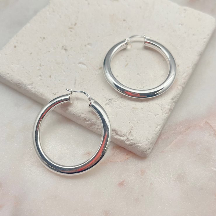 A photo of the Italian Sterling Silver Concave Hoops product