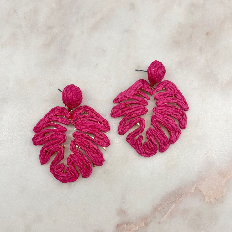 A photo of the Tropical Leaf Earrings in Hot Pink product