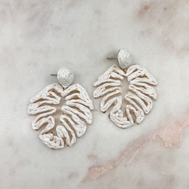 A photo of the Tropical Leaf Earrings in White product
