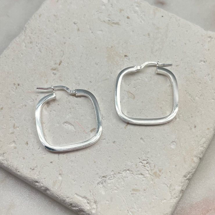 A photo of the Italian Sterling Silver Small Square Hoops product