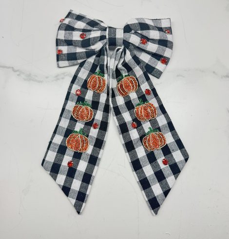 A photo of the Buffalo Check Pumpkin Hair Bow product